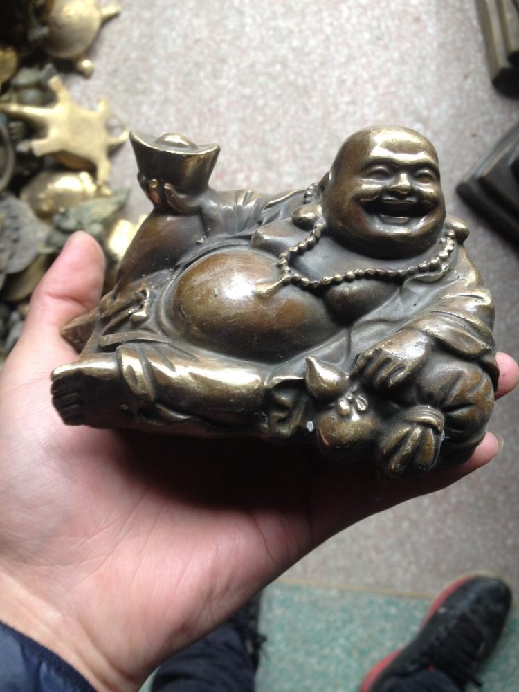 kerajinan dari logam patung buddha